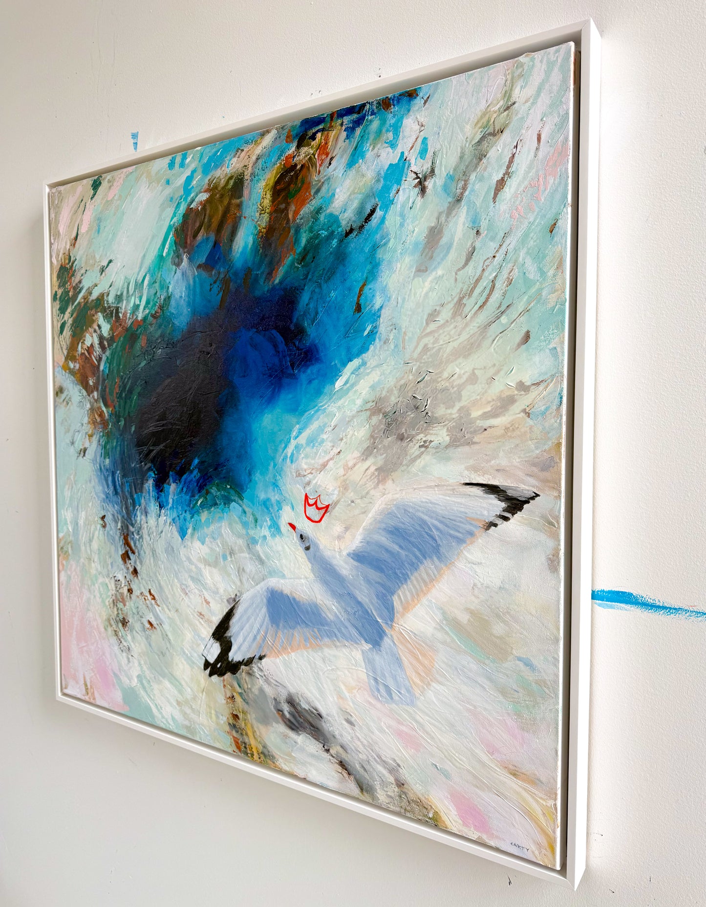 Abstract painting with a bird flying by New England artist Megan Carty and colorful background on a white wall