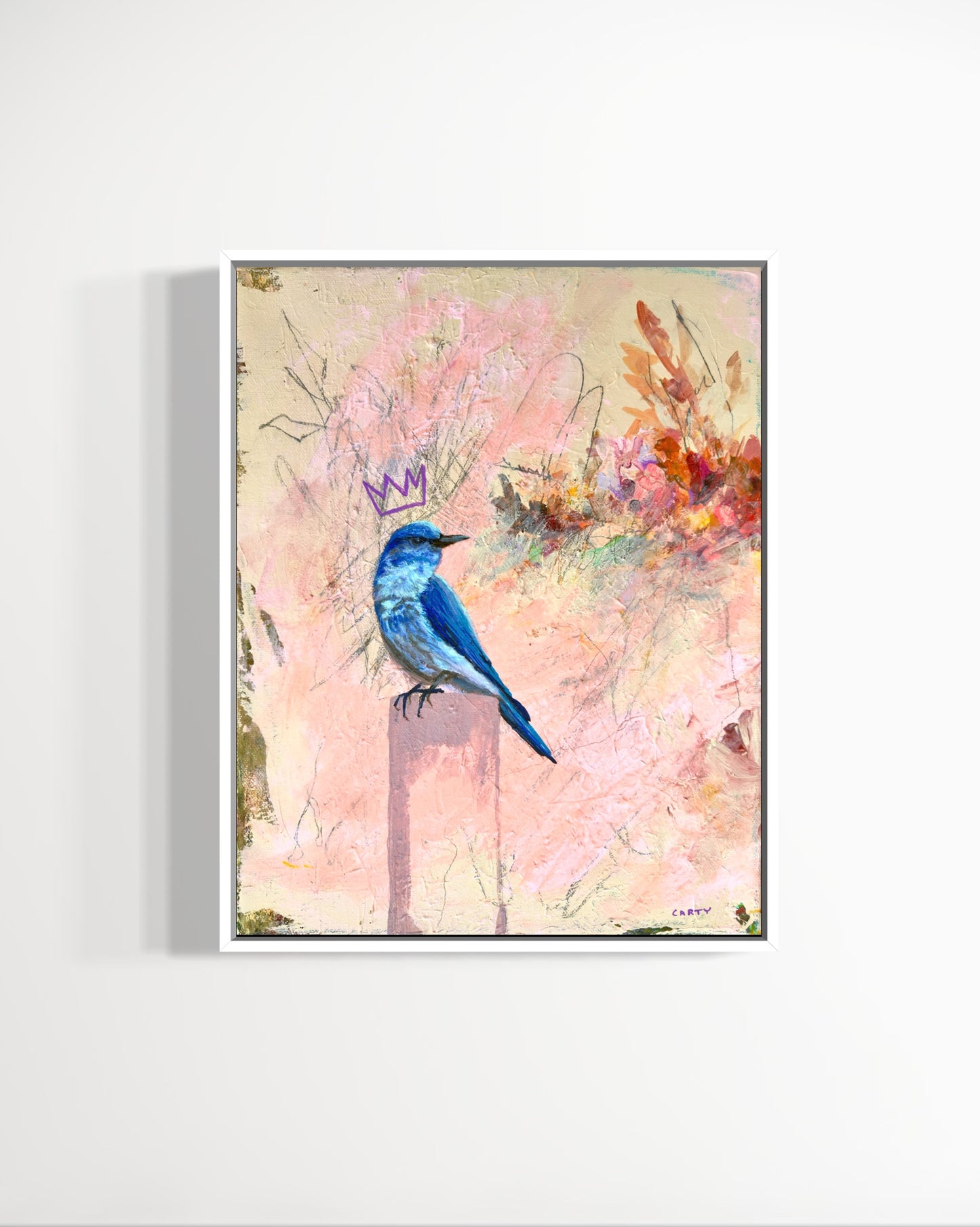 Framed artwork of a blue bird with a crown on a colorful floral background, painted by Boston artist Megan Carty