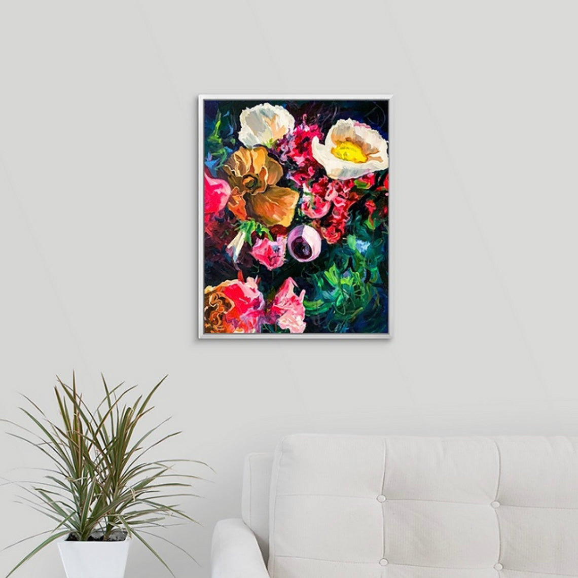 Dark moody blue floral painting by Boston area artist Megan Carty on a wall above a gray sofa